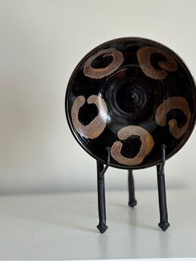 Decorative Black Ceramic Bowl with Brown Spiral Accents